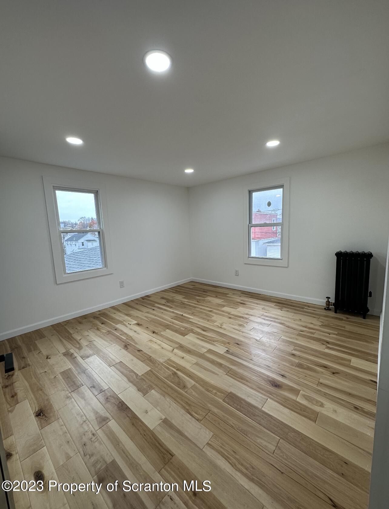 301 Oak Street Old Forge, PA 18518 - Photo 16 of 19 a view of empty room with wooden floor