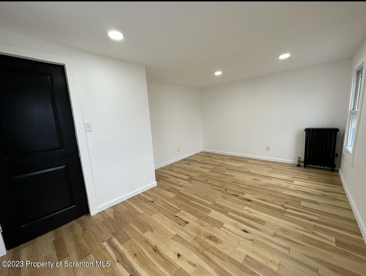 301 Oak Street Old Forge, PA 18518 - Photo 18 of 19 a view of empty room with wooden floor