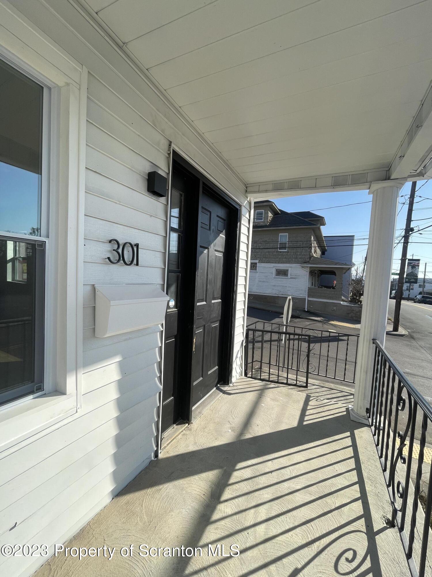 301 Oak Street Old Forge, PA 18518 - Photo 2 of 19 a kitchen with granite countertop a refrigerator and a sink