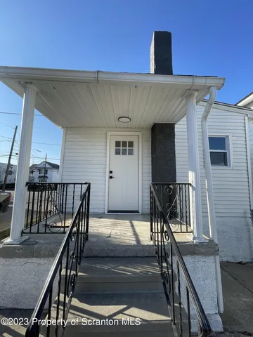 front view of a house with a patio