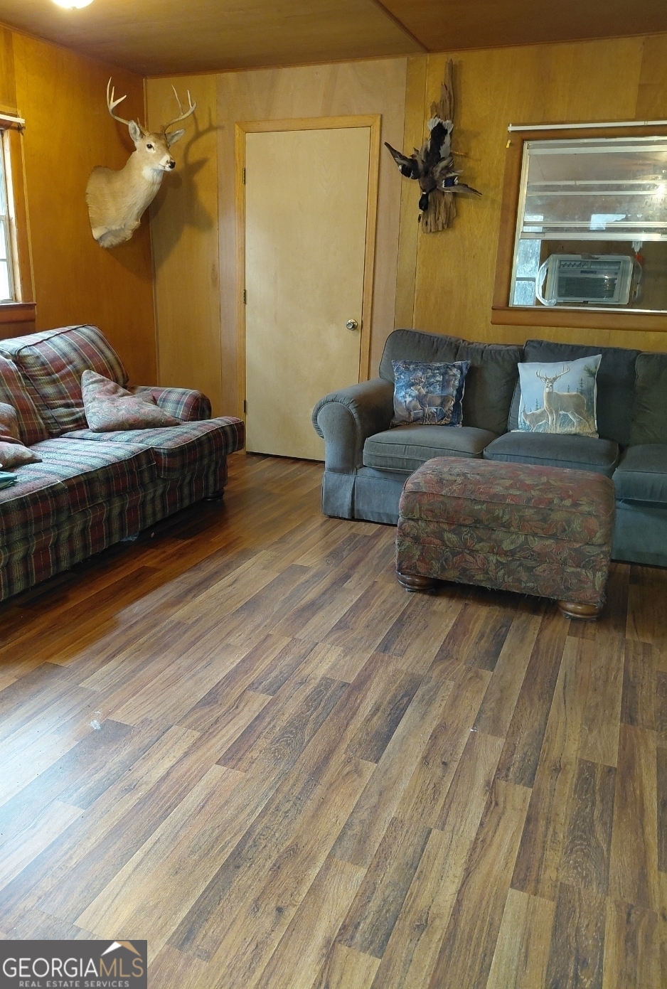 779 Ralph Davis Road, Unit 1 LAND LOT Folkston, GA 31537 - Photo 22 of 28 a living room with furniture and a wooden floor