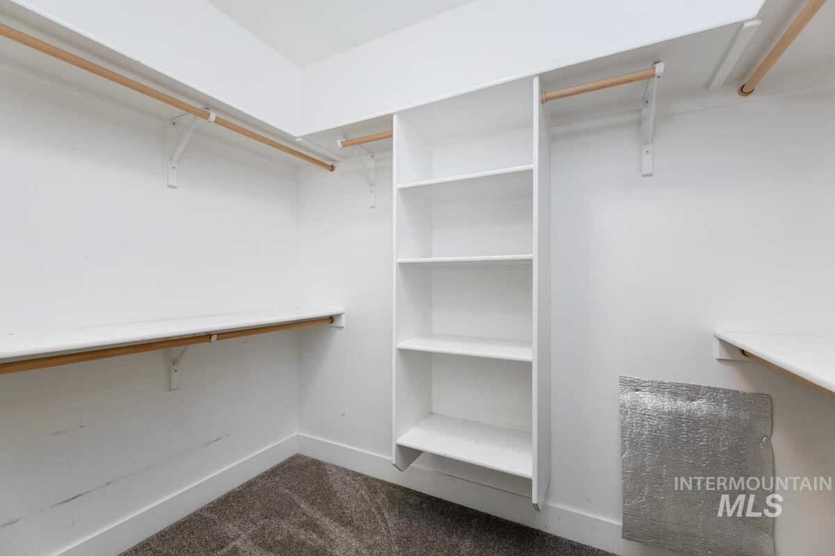 3902 North Rotaldo Avenue Meridian, ID 83646 - Photo 20 of 34 Walk in closet with dark colored carpet