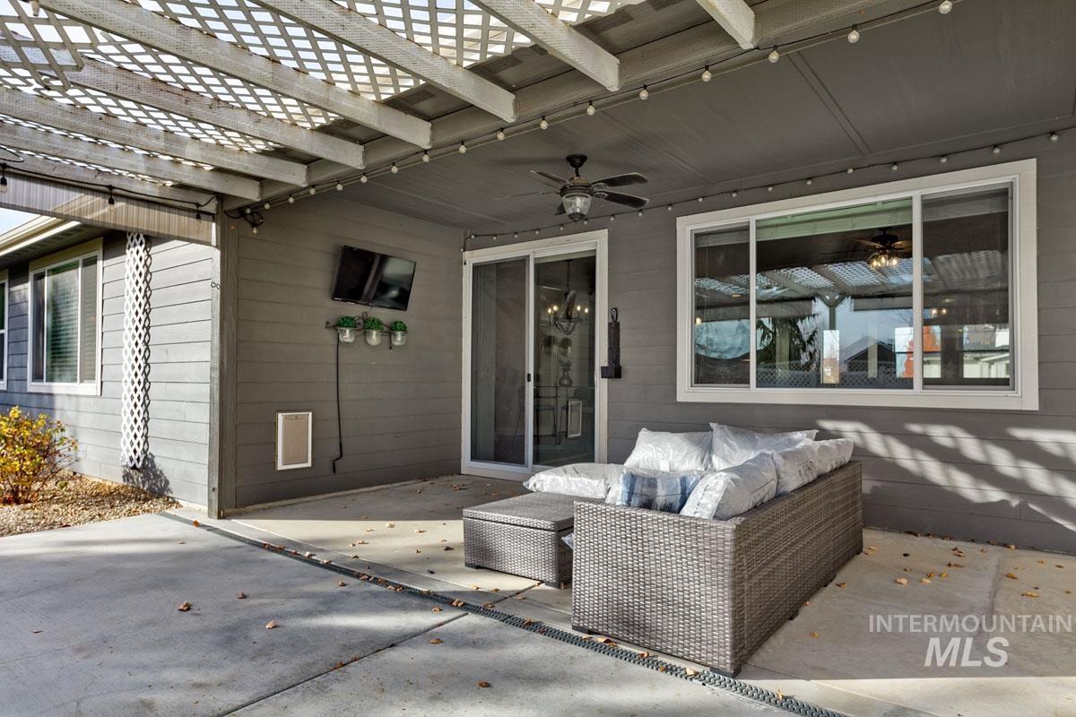 3902 North Rotaldo Avenue Meridian, ID 83646 - Photo 27 of 34 View of patio / terrace with a pergola, ceiling fan, and an outdoor living space
