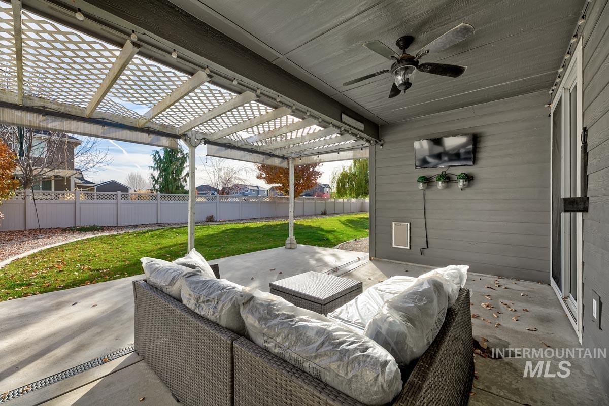 3902 North Rotaldo Avenue Meridian, ID 83646 - Photo 28 of 34 Fenced backyard with a patio area, a pergola, and ceiling fan