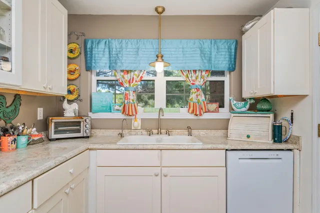 a kitchen with sink and window