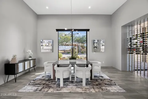 a bedroom with furniture and a large window
