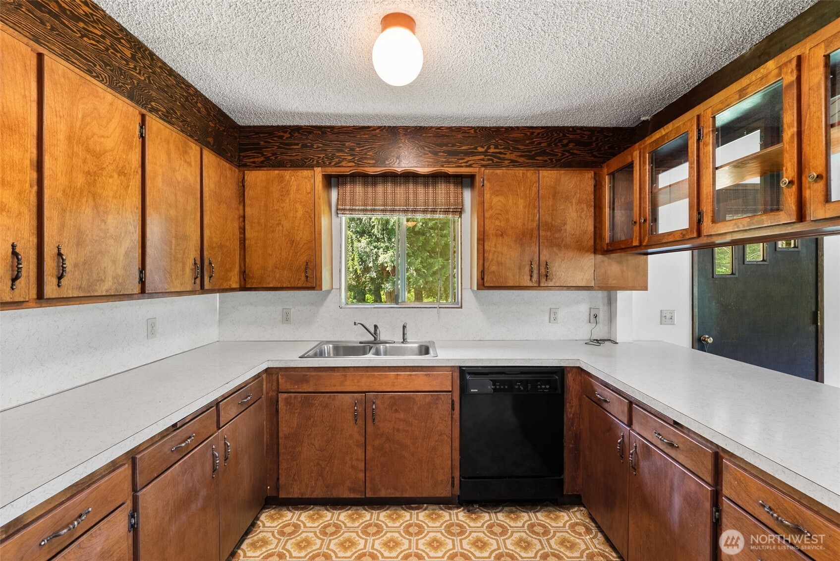 155 Bonell Road Randle, WA 98377 - Photo 9 of 38 a kitchen with a sink stove and cabinets