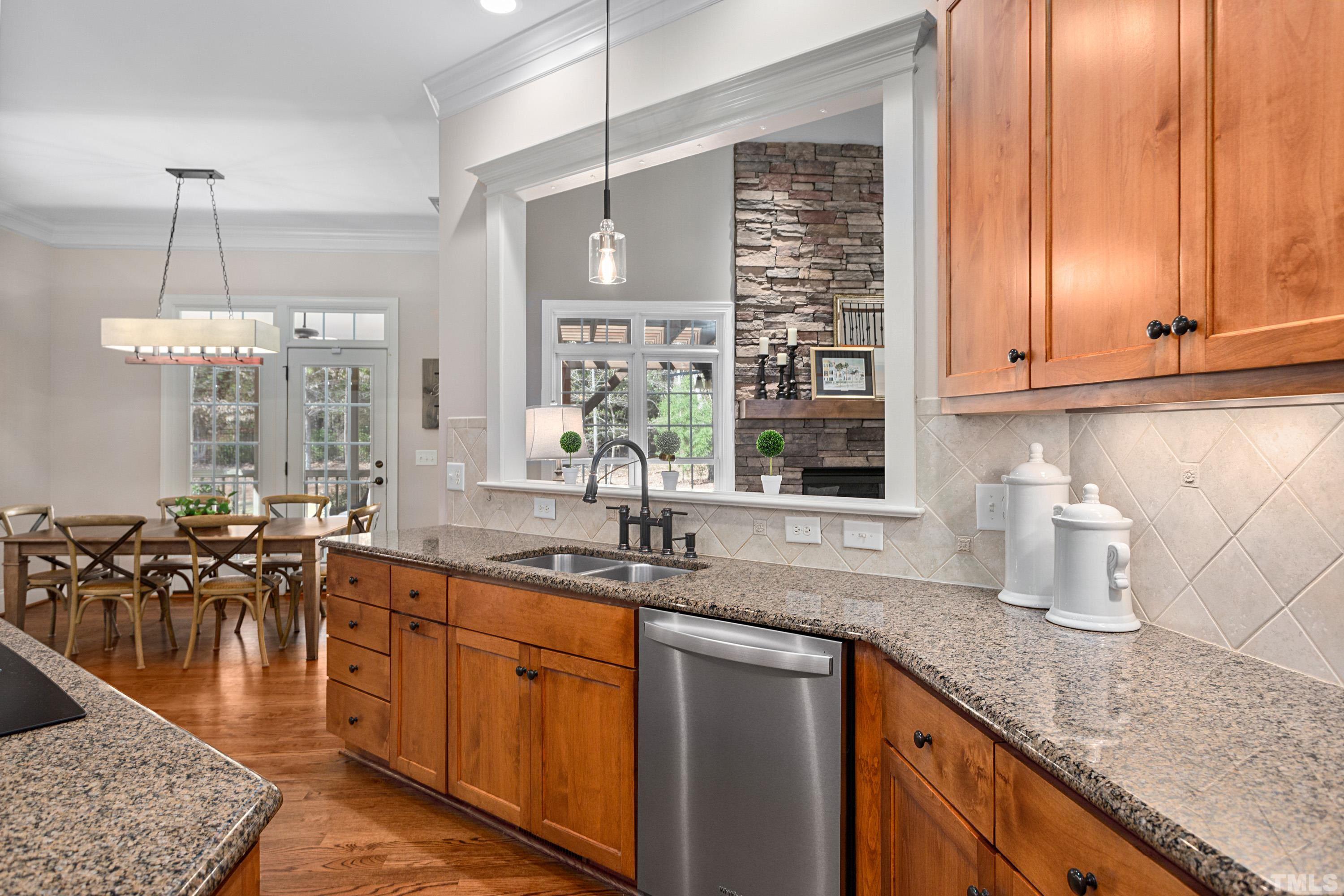 4328 Summer Brook Drive Apex, NC 27539 - Photo 15 of 76 Lovely Alderwood cabinetry! Open to Breakfast Room & Family Room.