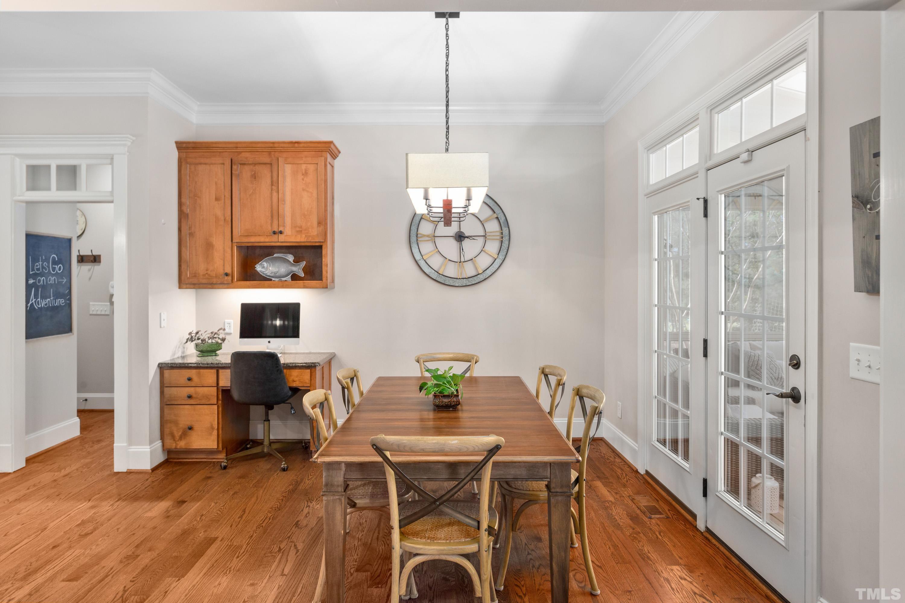 4328 Summer Brook Drive Apex, NC 27539 - Photo 18 of 76 a view of a dining room with furniture window and wooden floor