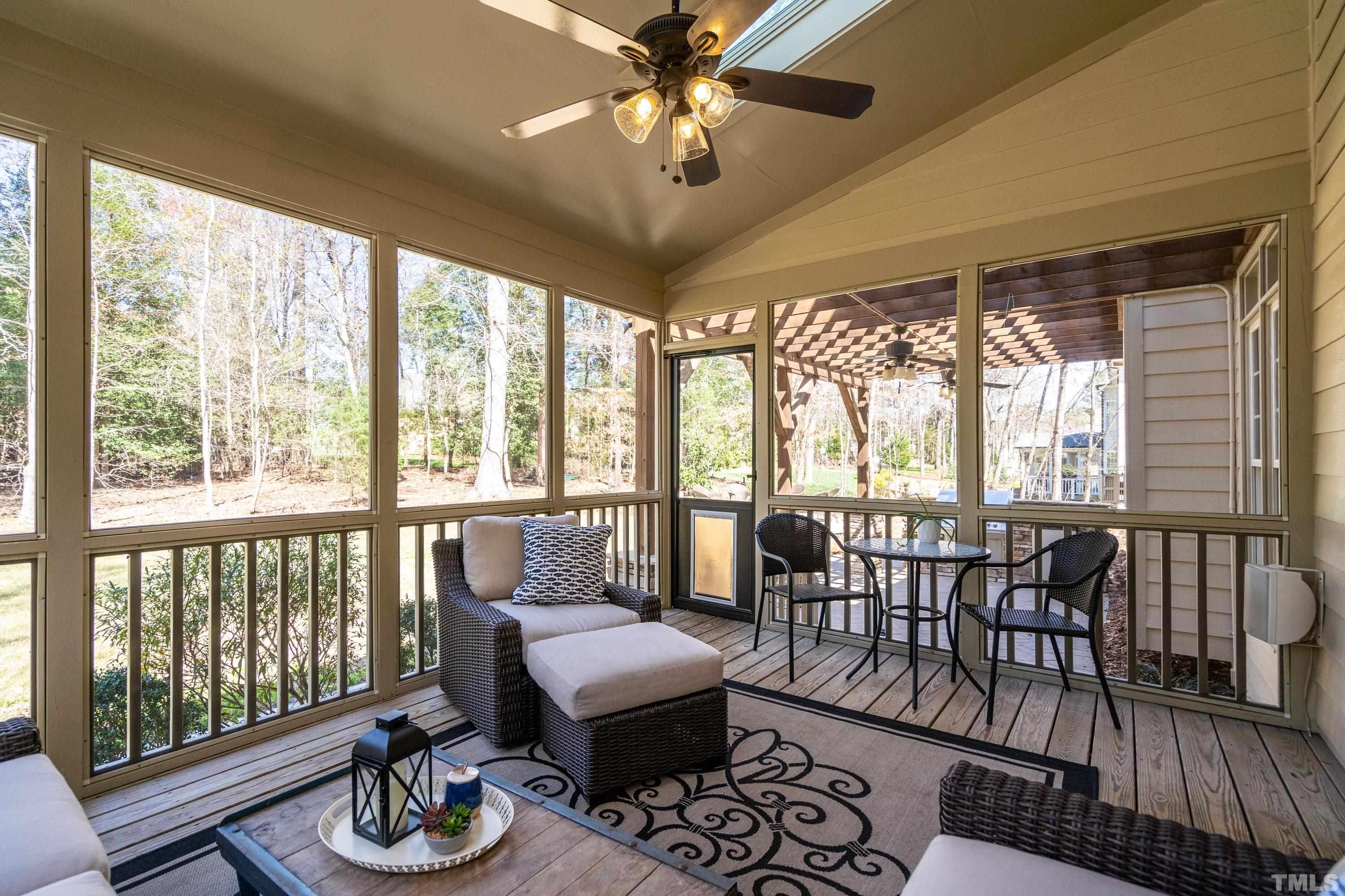 4328 Summer Brook Drive Apex, NC 27539 - Photo 19 of 76 a living room with furniture and a floor to ceiling window