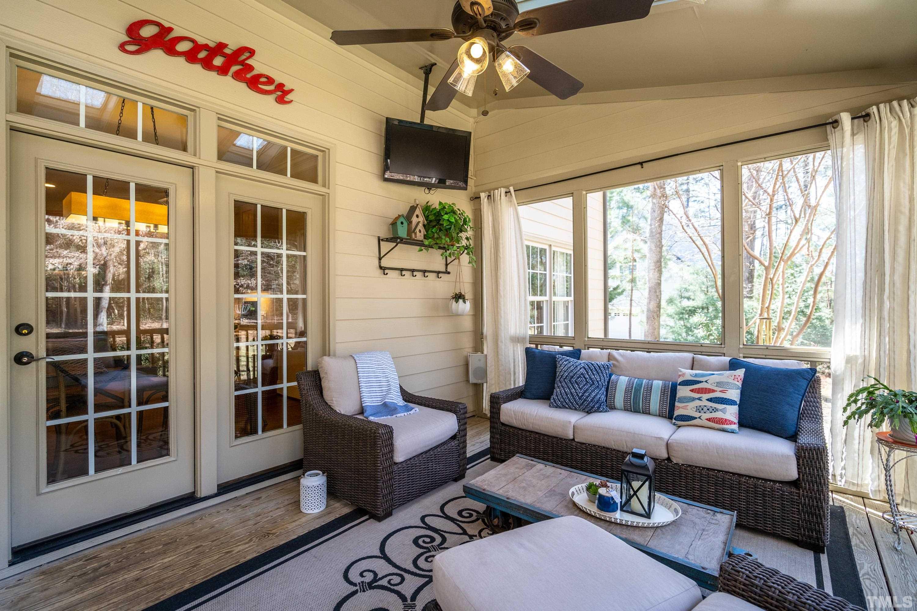 4328 Summer Brook Drive Apex, NC 27539 - Photo 20 of 76 a living room with furniture and a large window