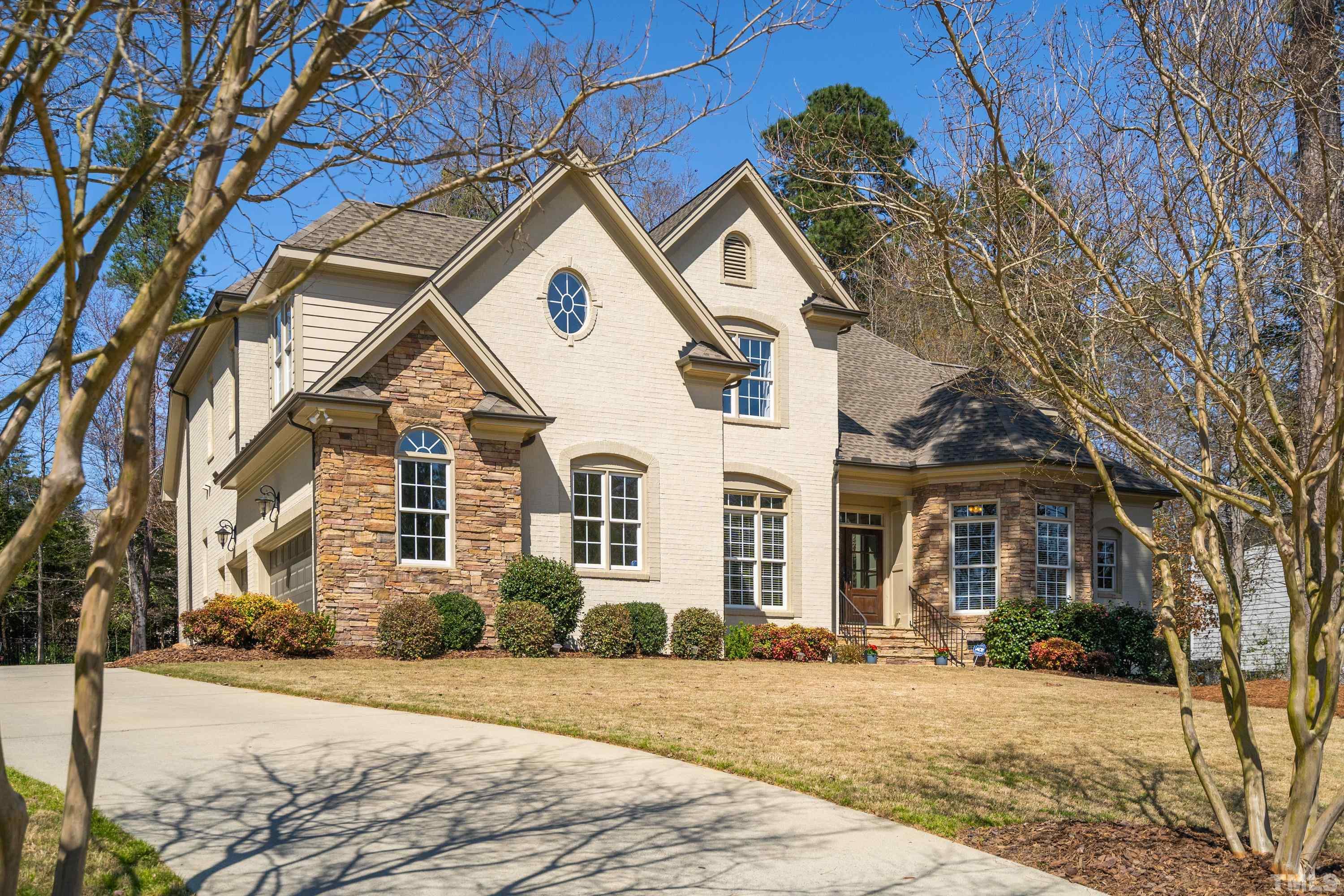 4328 Summer Brook Drive Apex, NC 27539 - Photo 2 of 76 a front view of a house with a yard