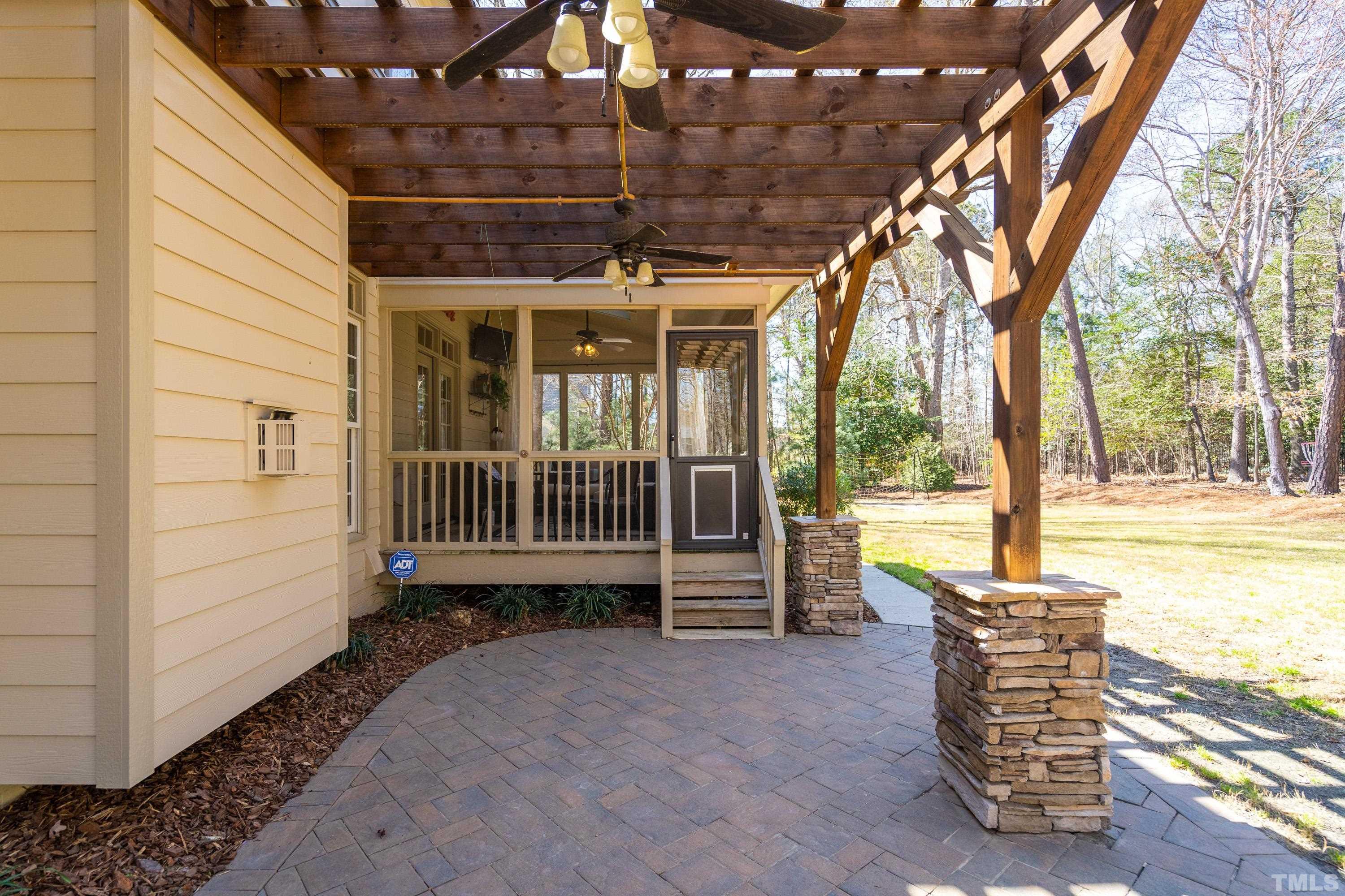 4328 Summer Brook Drive Apex, NC 27539 - Photo 22 of 76 a view of a porch with furniture and garden