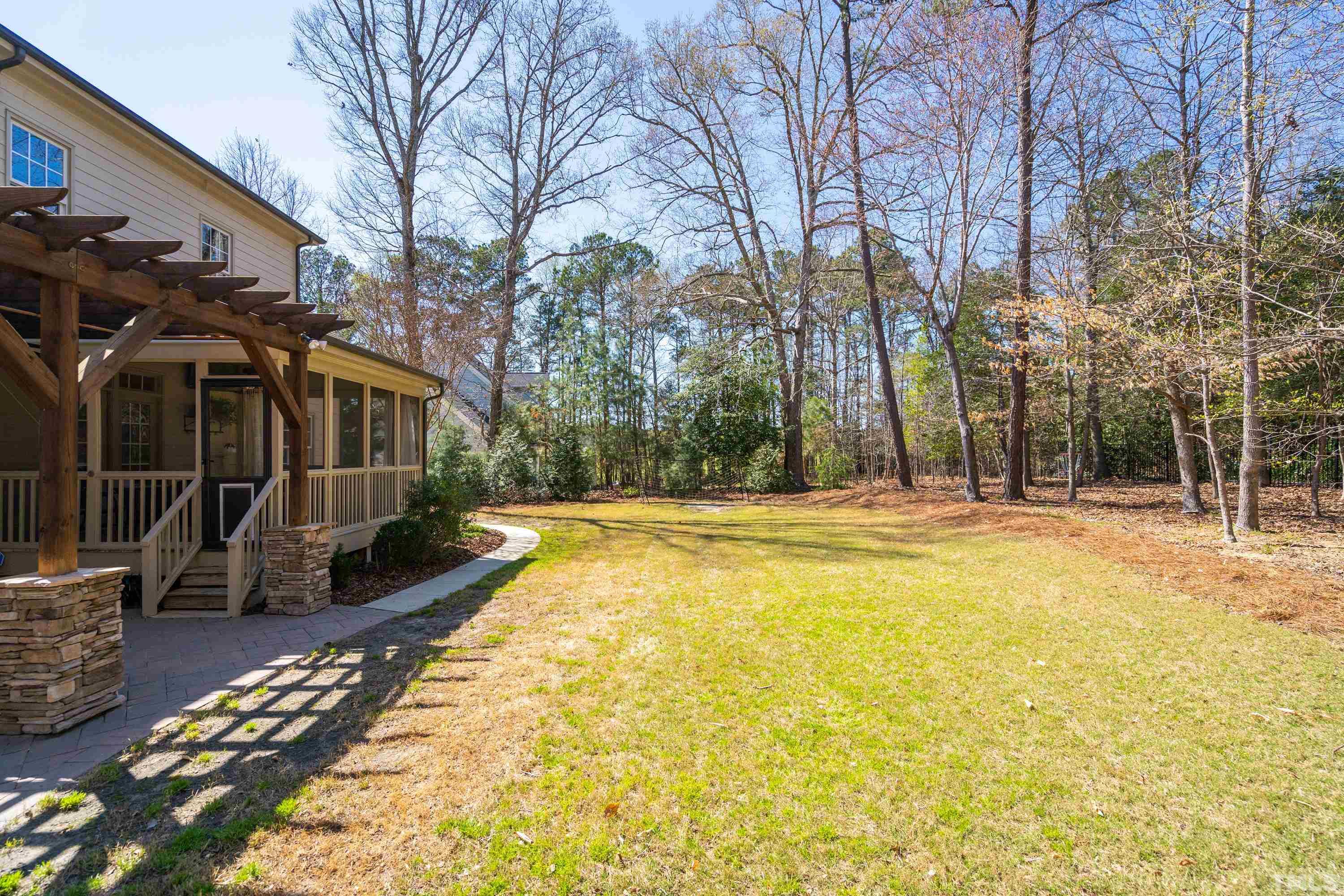 4328 Summer Brook Drive Apex, NC 27539 - Photo 27 of 76 a view of swimming pool with sitting area and garden