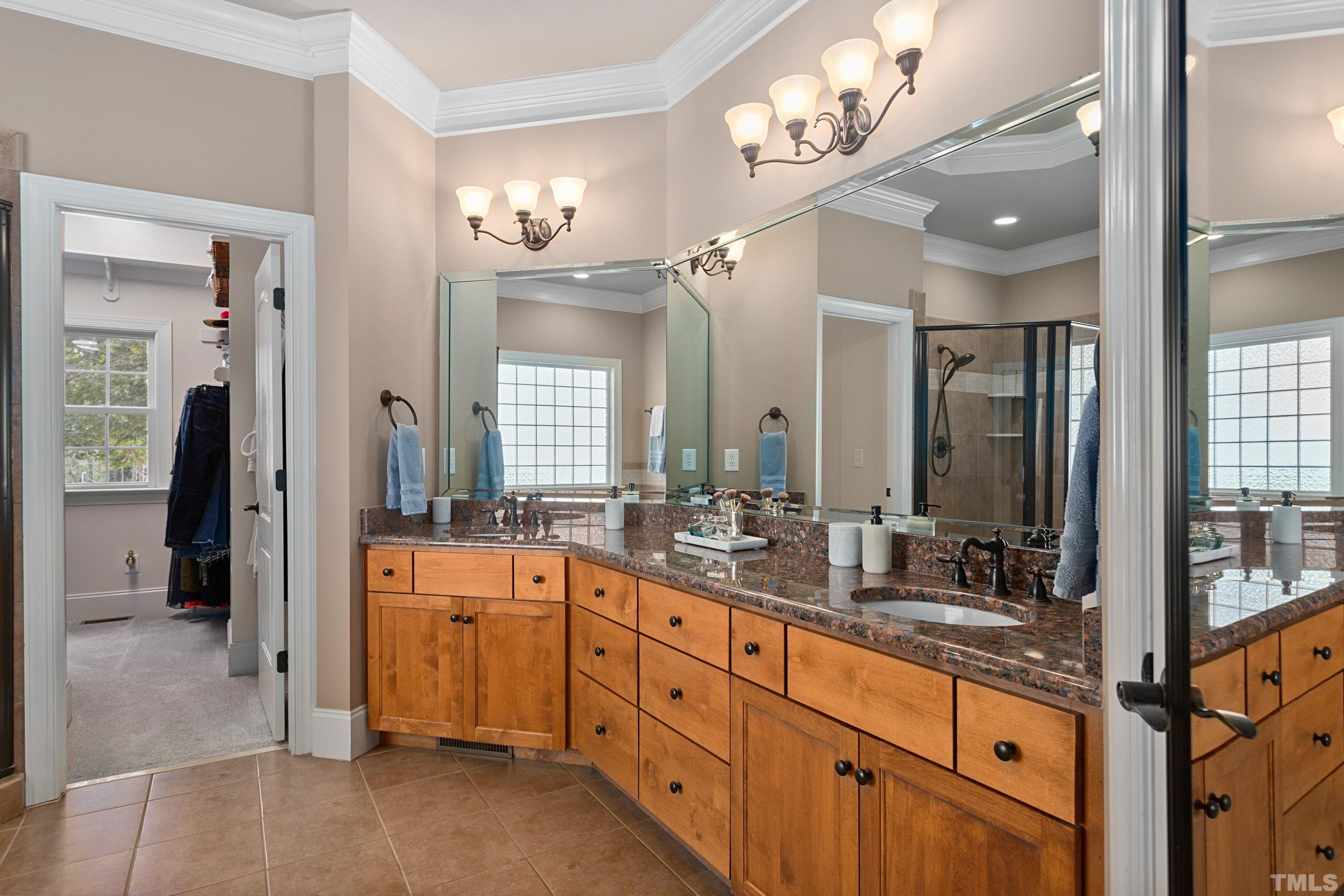 4328 Summer Brook Drive Apex, NC 27539 - Photo 32 of 76 Spacious bathroom features dual vanities + ample counter space, lovely alderwood cabinetry and separate shower & tub.
