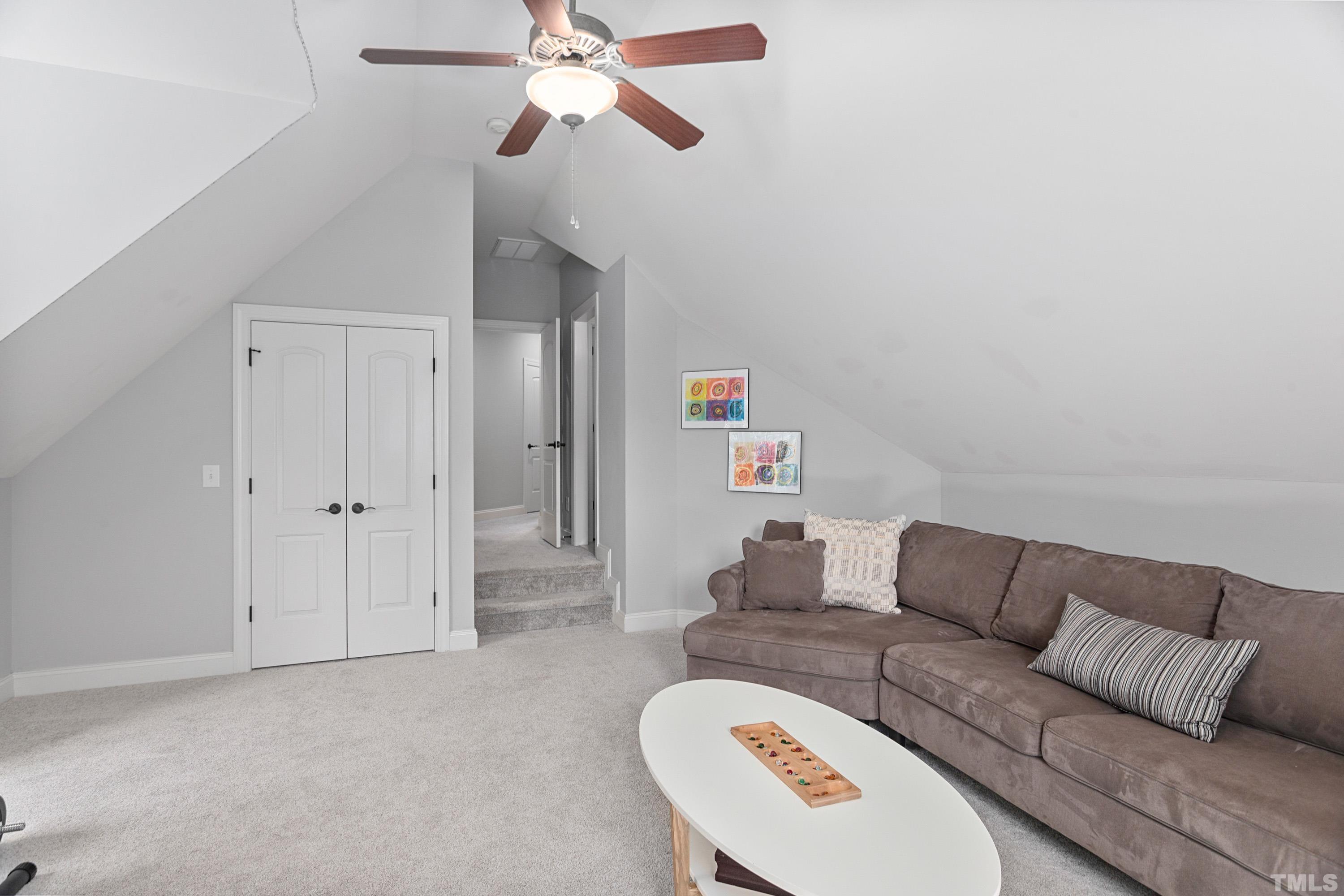 4328 Summer Brook Drive Apex, NC 27539 - Photo 40 of 76 a living room with furniture and a couch
