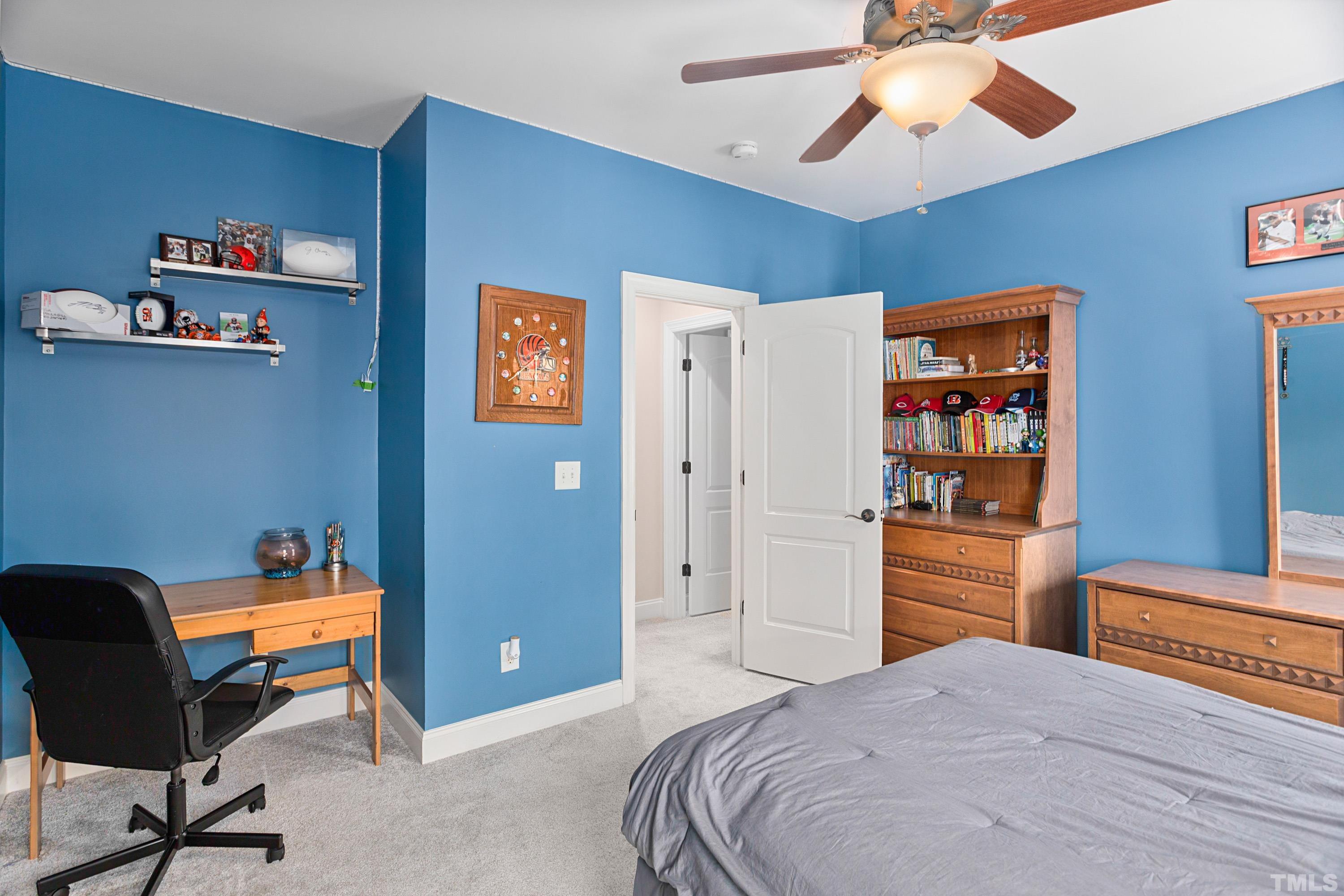 4328 Summer Brook Drive Apex, NC 27539 - Photo 52 of 76 a bedroom with a bed and furniture