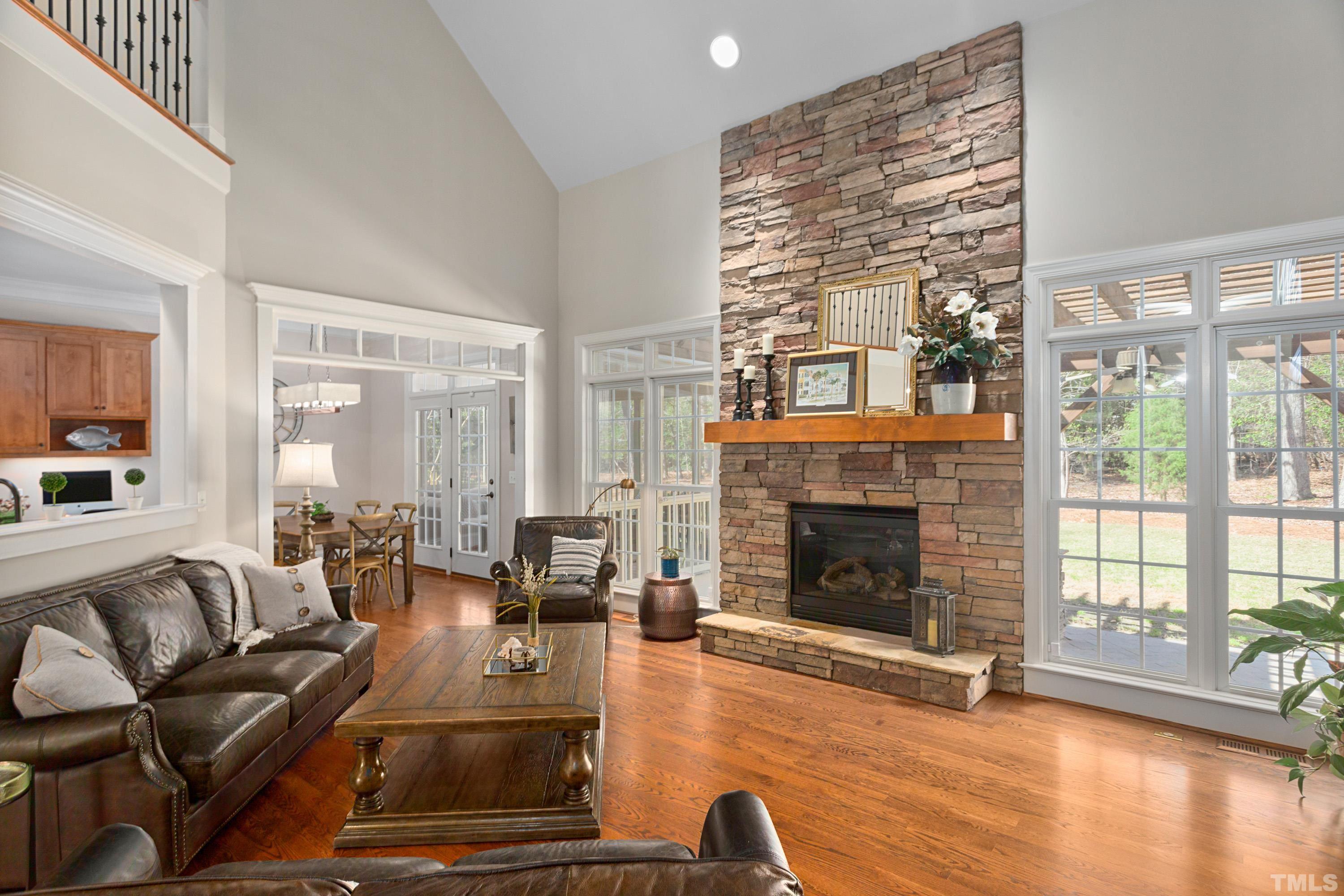 4328 Summer Brook Drive Apex, NC 27539 - Photo 7 of 76 a living room with furniture large window and a fireplace