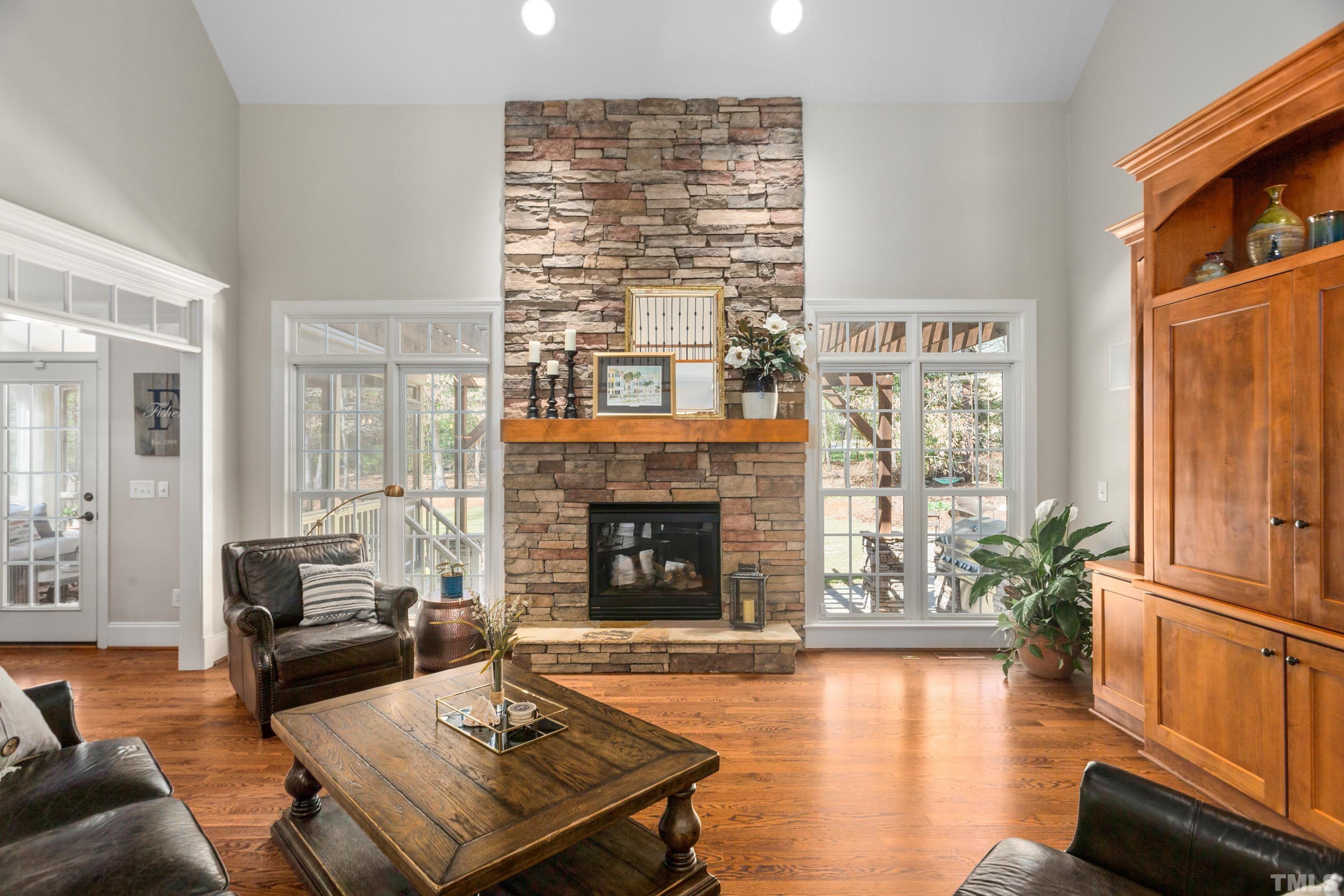 4328 Summer Brook Drive Apex, NC 27539 - Photo 9 of 76 a living room with furniture fireplace and window