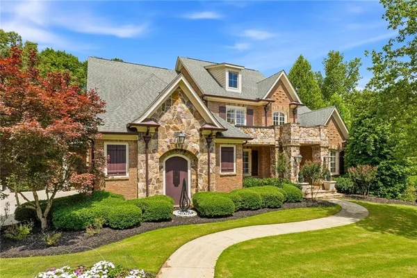 a front view of a house with a yard