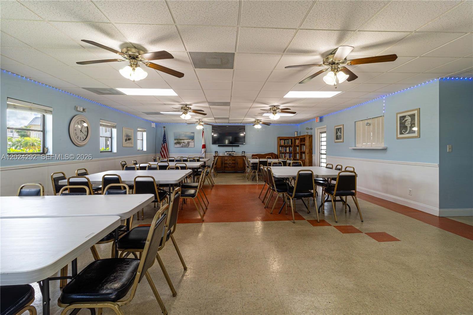 9780 Marina Boulevard, Unit 424 Boca Raton, FL 33428 - Photo 26 of 32 a view of a dining area with furniture and chandelier