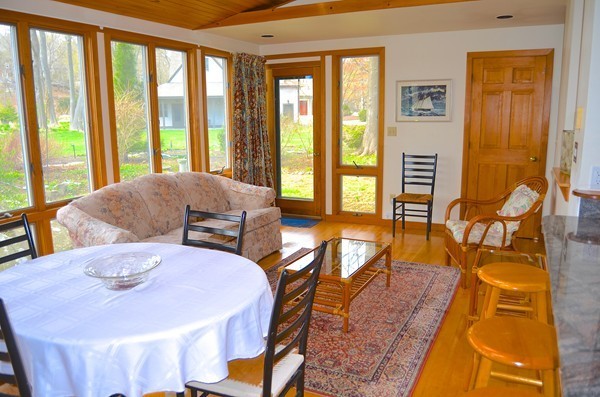 6 Davis Road Marblehead, MA 01945 - Photo 13 of 22 a living room with furniture and two large windows