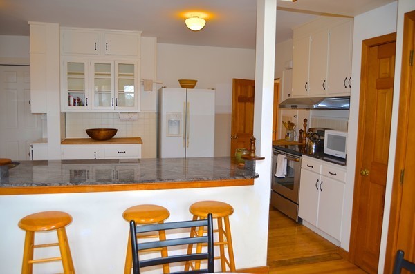 6 Davis Road Marblehead, MA 01945 - Photo 14 of 22 a view of a kitchen with a tub and dining space