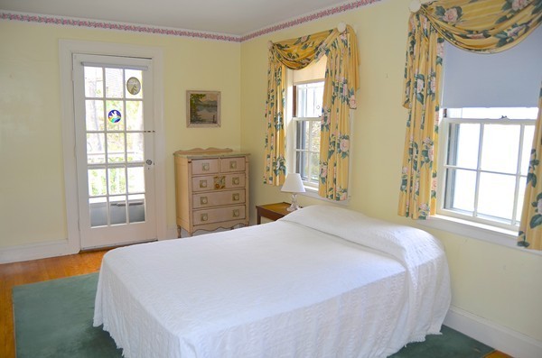 6 Davis Road Marblehead, MA 01945 - Photo 19 of 22 a bedroom with a bed dresser and a window