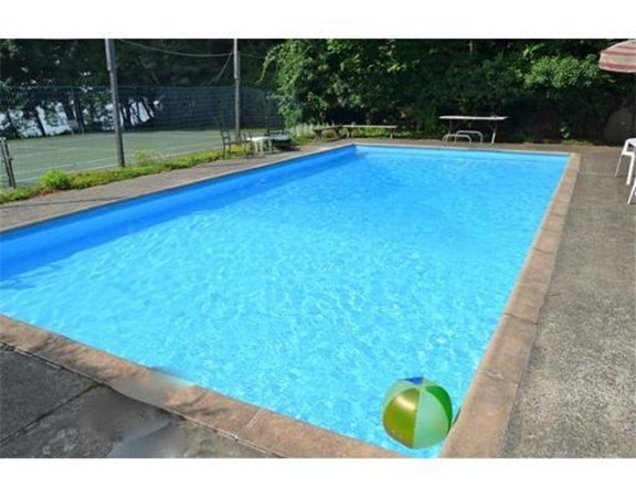 6 Davis Road Marblehead, MA 01945 - Photo 3 of 22 a view of a swimming pool with a yard