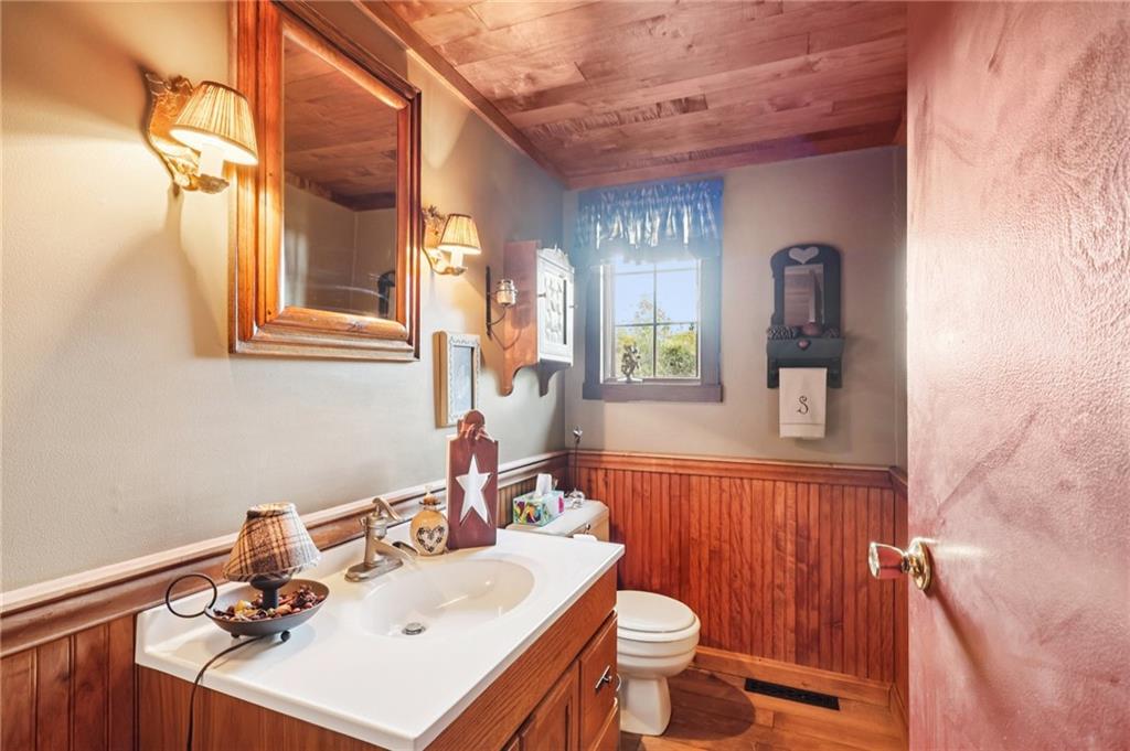 557 Wilson Mill Road New Wilmington, PA 16142 - Photo 23 of 41 a bathroom with a sink vanity mirror and toilet
