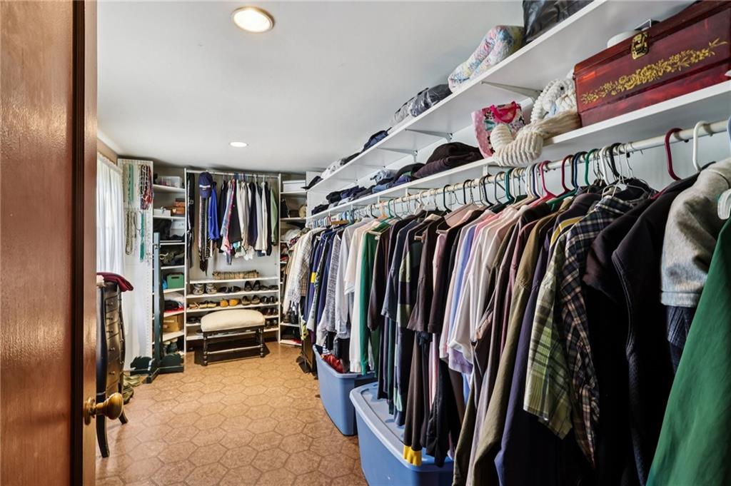 557 Wilson Mill Road New Wilmington, PA 16142 - Photo 33 of 41 a view of walk in closet with clothes and shoes