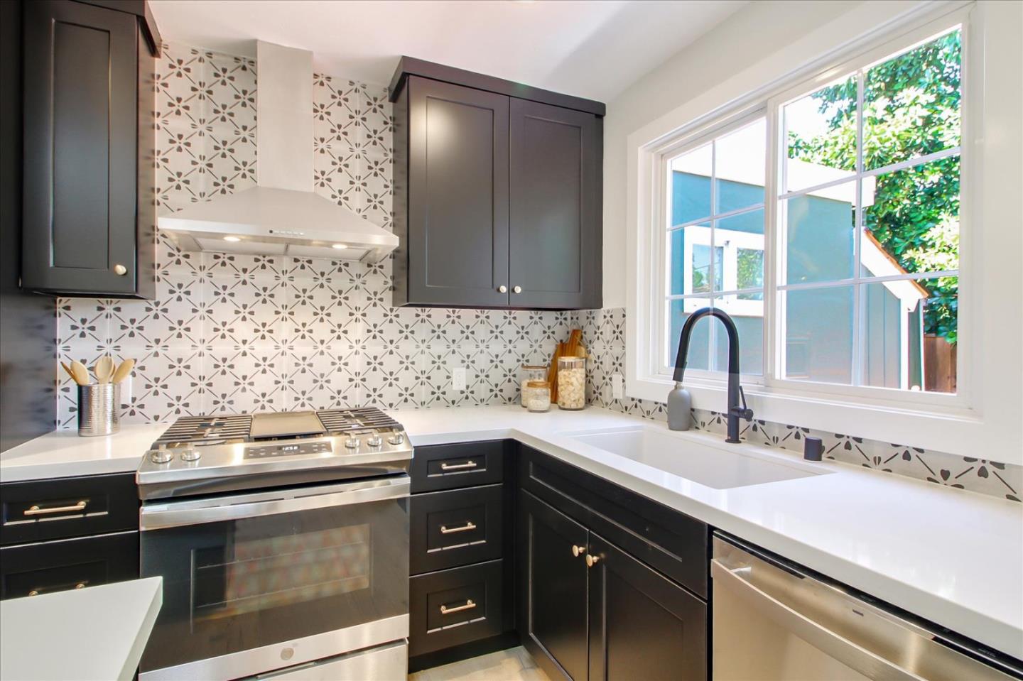 2229 Tulip Road San Jose, CA 95128 - Photo 13 of 34 a kitchen with a sink and cabinets