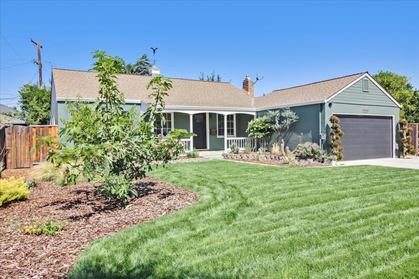 2229 Tulip Road San Jose, CA 95128 - Photo 2 of 34 a front view of a house with a yard