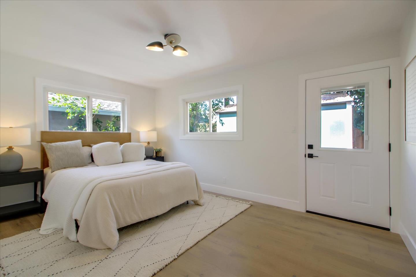 2229 Tulip Road San Jose, CA 95128 - Photo 22 of 34 a spacious bedroom with a bed and a window