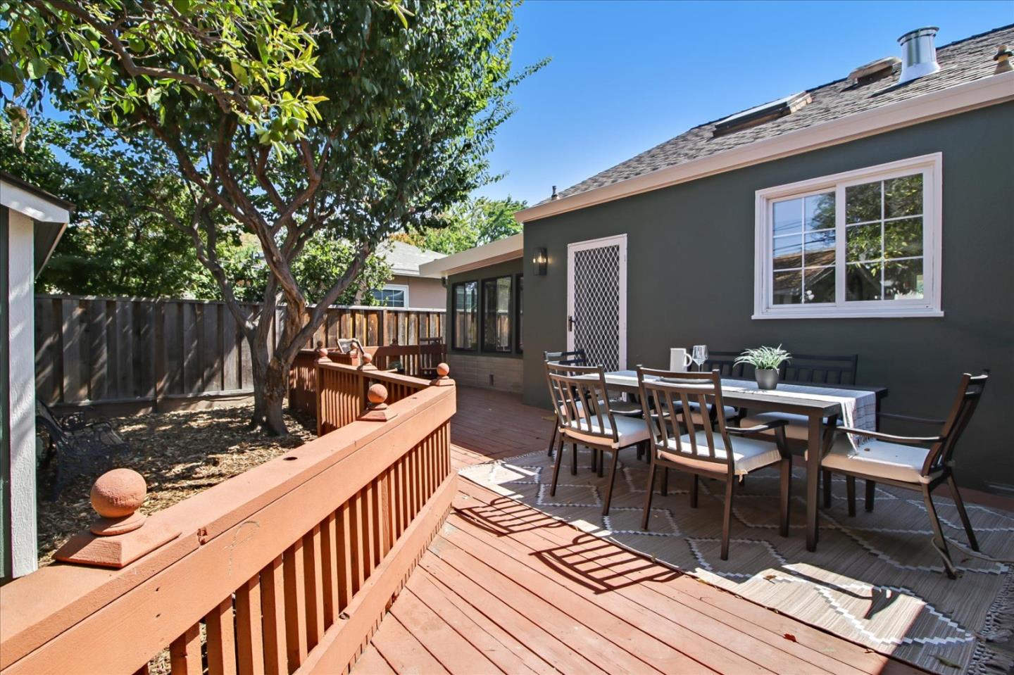 2229 Tulip Road San Jose, CA 95128 - Photo 33 of 34 a view of a patio with table and chairs with wooden floor and fence
