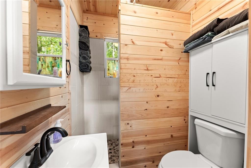 101 Rocket Drive Cleveland, GA 30528 - Photo 13 of 20 a bathroom with a sink toilet and shower