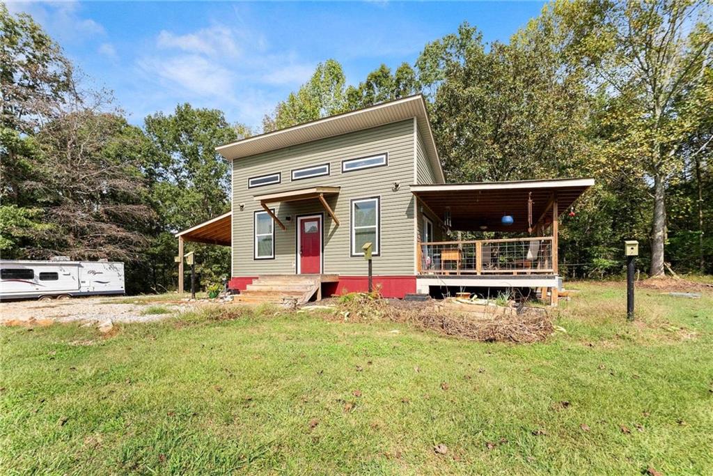 101 Rocket Drive Cleveland, GA 30528 - Photo 2 of 20 a view of a house with backyard and a tree