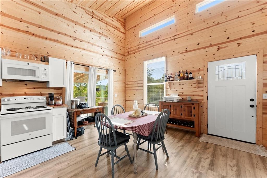101 Rocket Drive Cleveland, GA 30528 - Photo 5 of 20 a view of a dining room with furniture window and wooden floor
