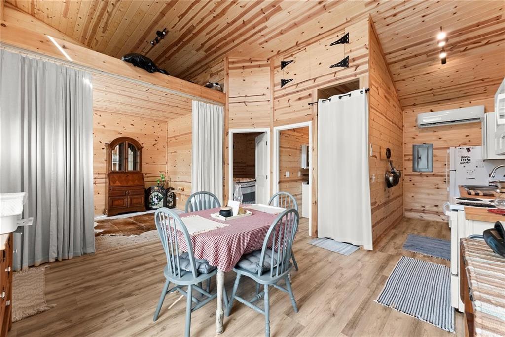 101 Rocket Drive Cleveland, GA 30528 - Photo 8 of 20 a view of a dining room with furniture window and wooden floor