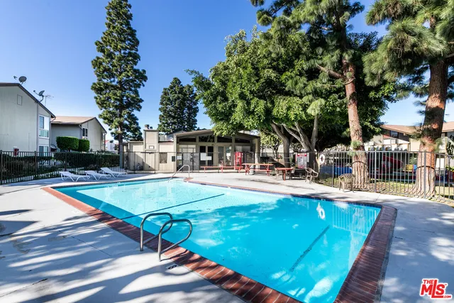 a view of a swimming pool with sitting area