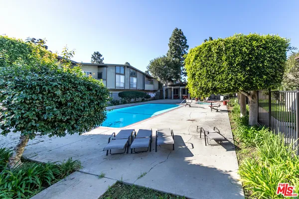 a view of a backyard with sitting area