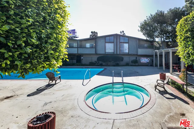 a view of a swimming pool with a patio