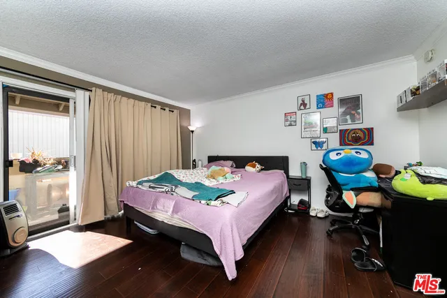 a bedroom with bed and a window