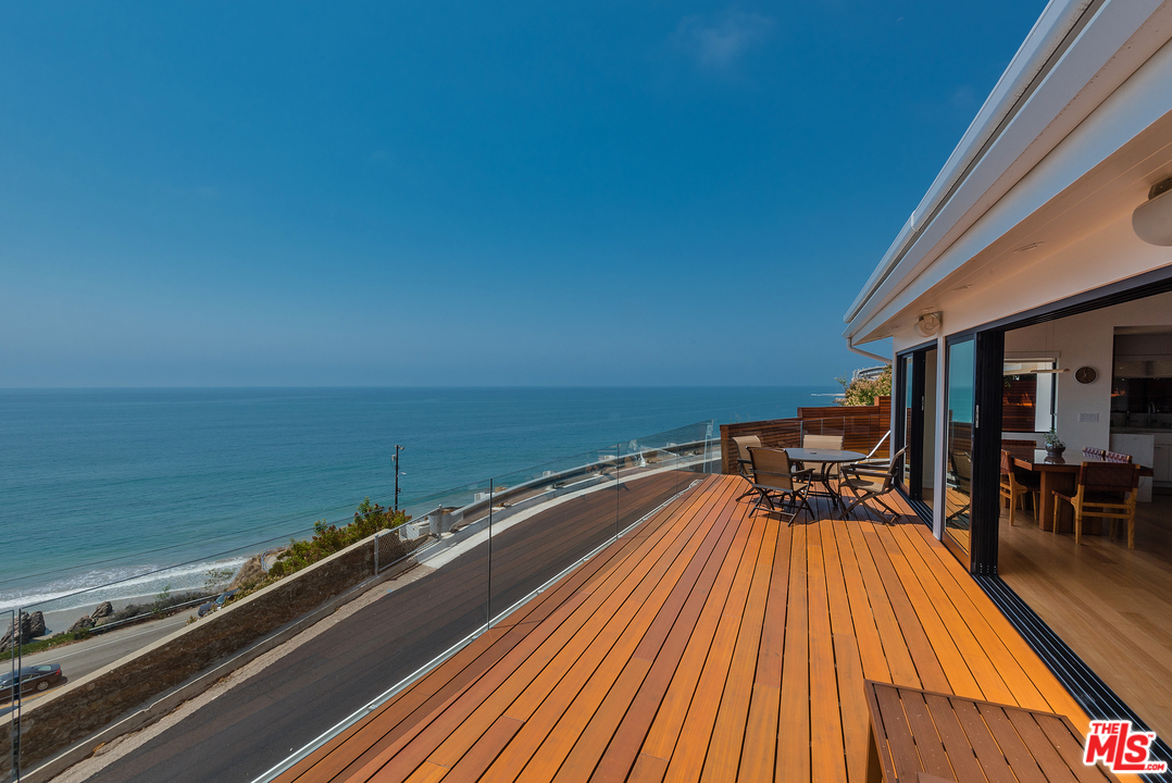 a view of a balcony with an ocean view