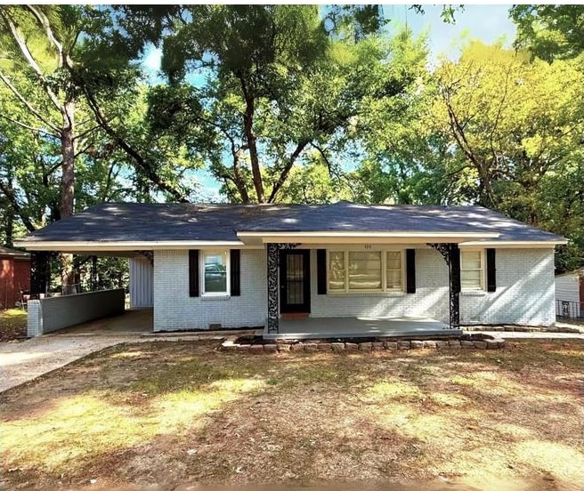 a backyard of a house with yard and outdoor seating