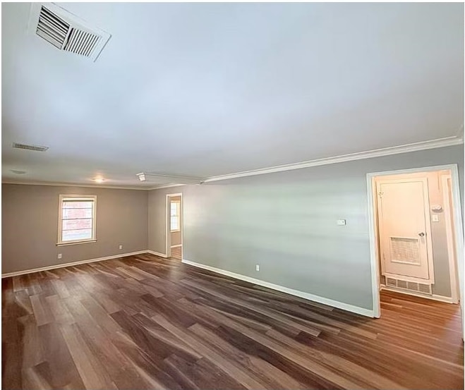 720 Rosebanks Road Memphis, TN 38116 - Photo 14 of 19 Empty room featuring dark wood finished floors and ornamental molding