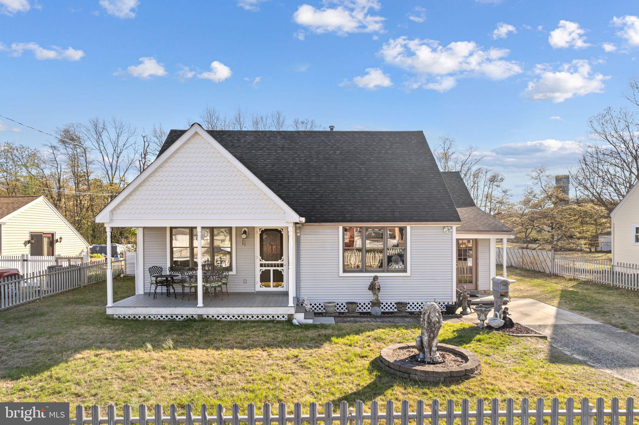 a view of a house with swimming pool and sitting area