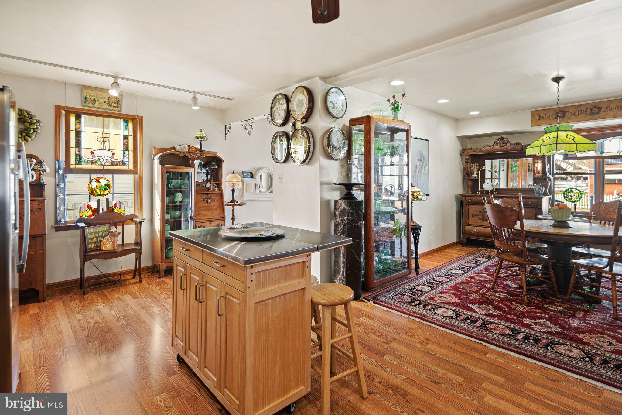 91 Estates Road Pine Hill, NJ 08021 - Photo 16 of 34 a kitchen with stainless steel appliances granite countertop a stove refrigerator and a dining table