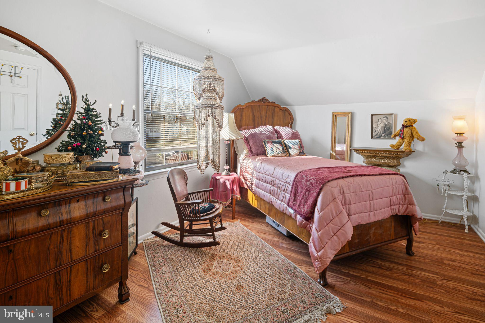 91 Estates Road Pine Hill, NJ 08021 - Photo 23 of 34 a bedroom with a bed and wooden floor