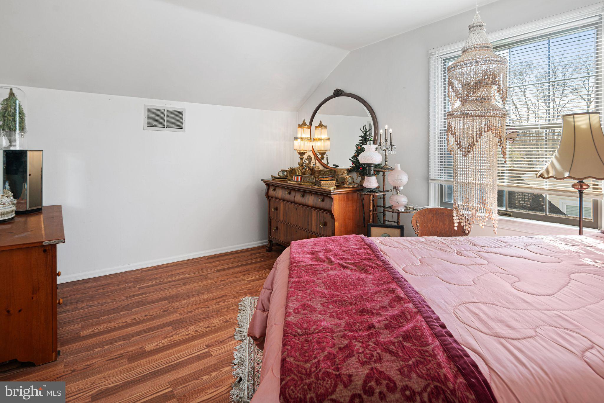 91 Estates Road Pine Hill, NJ 08021 - Photo 24 of 34 a bedroom with a bed and a flat screen tv